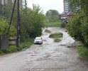 Улица в самом центре города. Состояние просто ужасное. В дождь проехать практически нельзя.