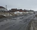 Дорожное покрытие на большей части указанного отрезка отсутствует в принципе, его там никогда не было. Там где асфальт был - от него почти ничего не осталось. Машины объезжая ямы и канавы укатывают грунт вблизи дороги.Постоянно присутствует опасность столкновения транспорта встречного направления при совершении маневров при выборе наилучшего пути.Люди очень ждут перемен и мучаются каждый день...