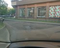 Яма, глубиной уже почти 15 см, об которую бьются все автомобили, из-за попыток её объехать образовываются пробки во дворе