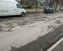 Глубокие ямы на тротуаре и проезжей части на улице Киселева у музыкальной школы и 23-й школы.