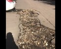 Отсутствие асфальта на недавно отремонтированной дороге на ул. Терешковой между домами 9 и 7а