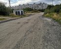 Убитая дорога по улице Южная в городе Мурманск.